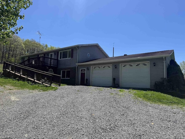 143 Sunday Dr, Fairmont, WV 26554 - view of front of property featuring a garage and gravel driveway