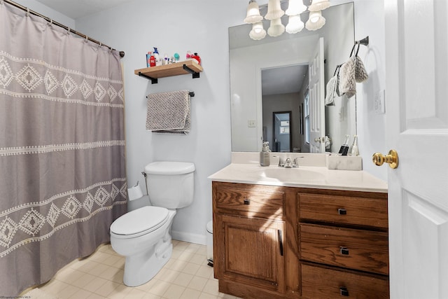 bathroom featuring vanity, tile patterned flooring, a notable chandelier, and toilet