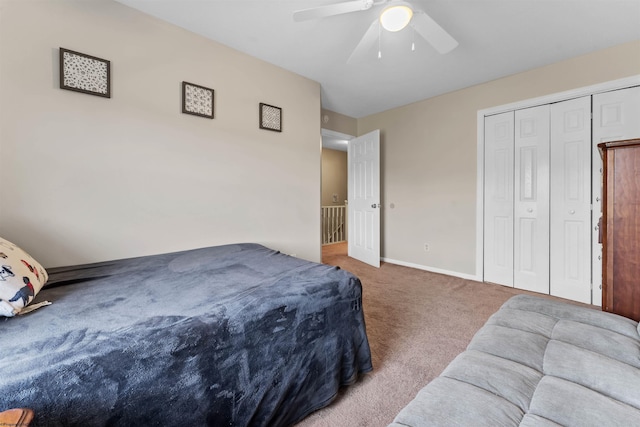 bedroom featuring carpet floors, ceiling fan, baseboards, and a closet