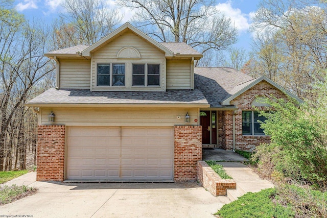 traditional home with an attached garage, a shingled roof, brick siding, and concrete driveway