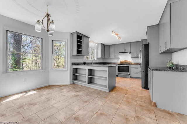 kitchen with gray cabinets, open shelves, stainless steel appliances, and under cabinet range hood