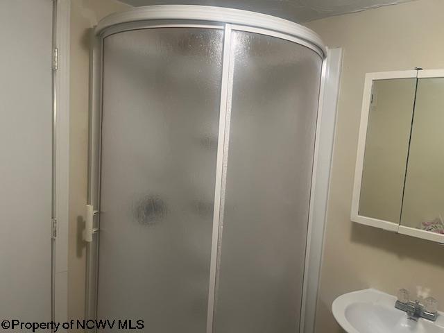 510 6th St, Fairmont, WV 26554 - bathroom featuring a sink and a shower stall