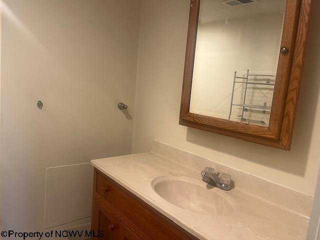 510 6th St, Fairmont, WV 26554 - bathroom with vanity and visible vents
