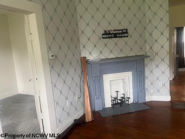 510 6th St, Fairmont, WV 26554 - details featuring baseboards, wallpapered walls, and wood finished floors