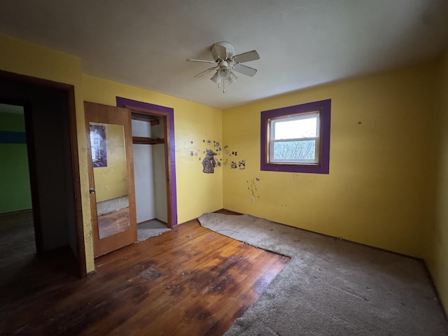 unfurnished bedroom with a ceiling fan and wood finished floors