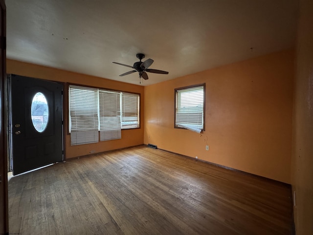 entrance foyer with ceiling fan and wood finished floors