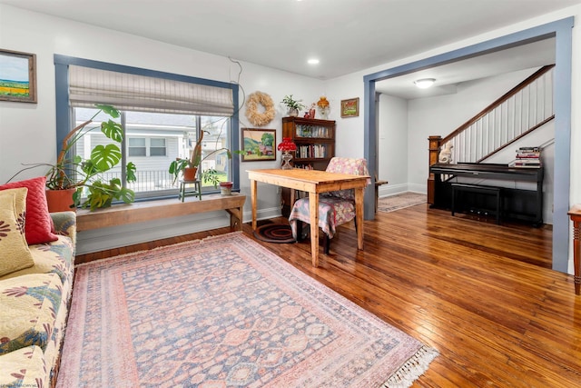 office space with baseboards, wood-type flooring, and recessed lighting