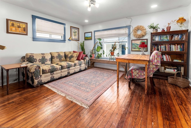 office area with plenty of natural light and hardwood / wood-style flooring