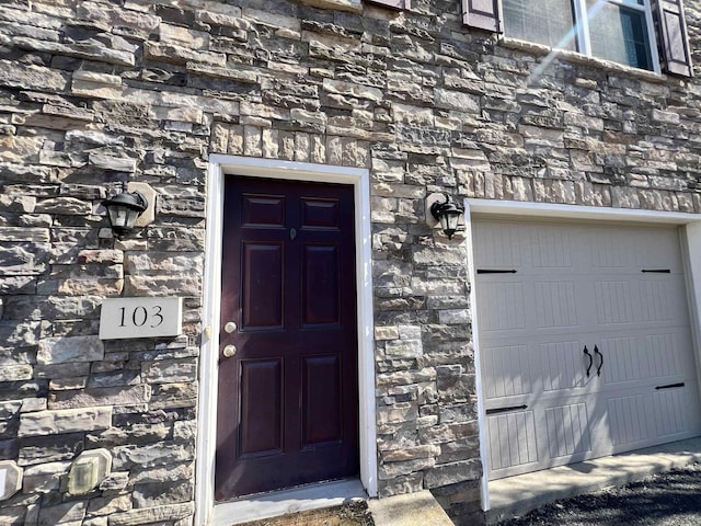 entrance to property with stone siding