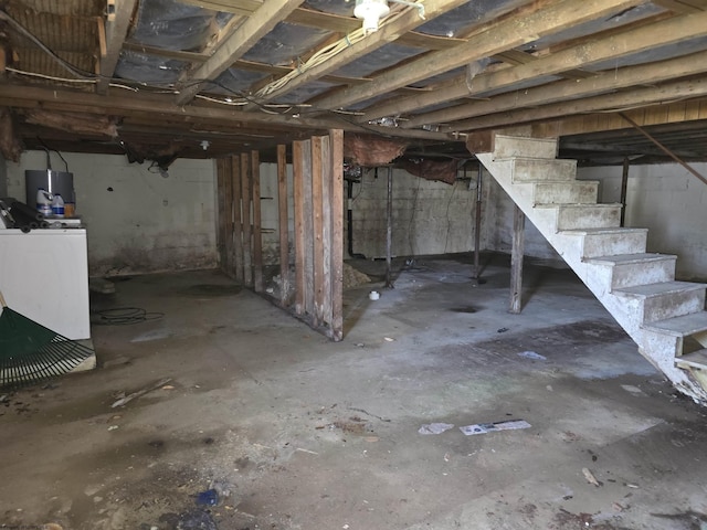 130 Hunsaker St, Fairmont, WV 26554 - unfinished below grade area with water heater, washer / dryer, and stairs