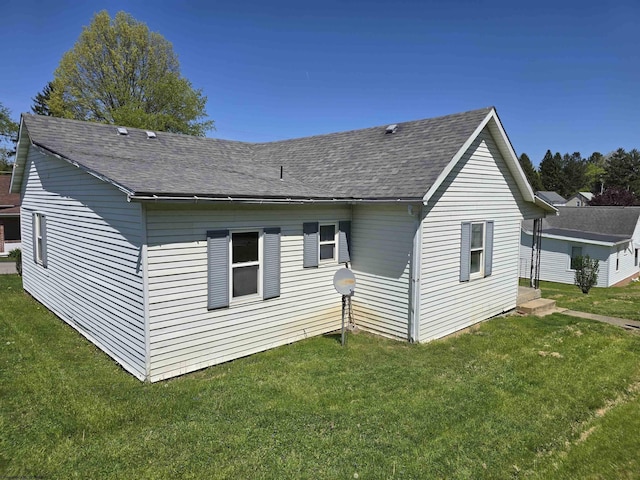 130 Hunsaker St, Fairmont, WV 26554 - rear view of property with a shingled roof and a yard
