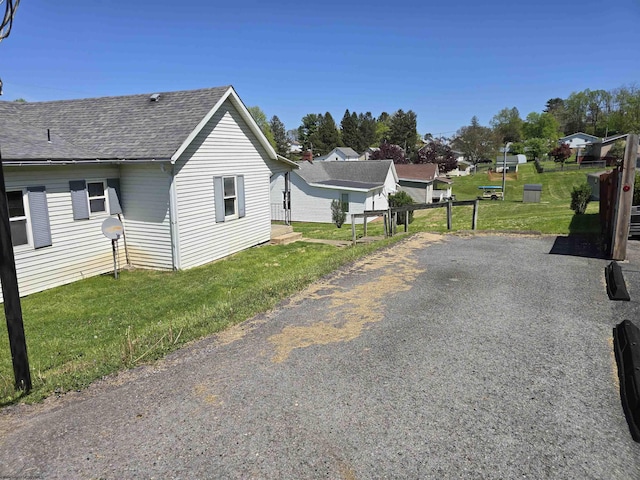 130 Hunsaker St, Fairmont, WV 26554 - view of property exterior with roof with shingles and a yard