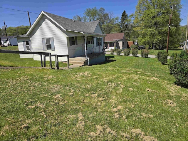 130 Hunsaker St, Fairmont, WV 26554 - exterior space with a lawn, covered porch, and a shingled roof