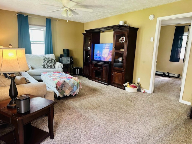 carpeted living room with baseboards, a textured ceiling, ceiling fan, and baseboard heating