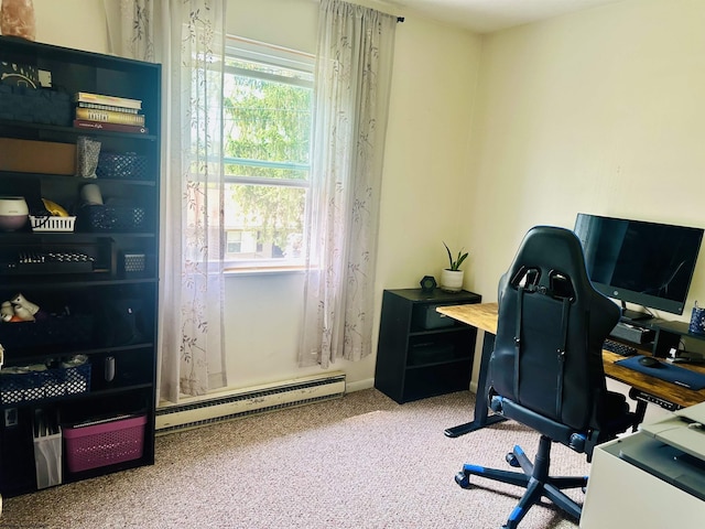 carpeted office space with a baseboard heating unit