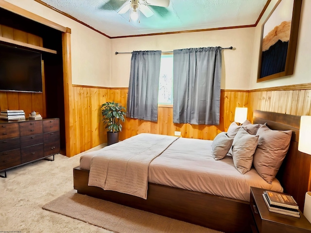 108 Toothman Run Rd, Rivesville, WV 26588 - carpeted bedroom with crown molding, wood walls, a ceiling fan, and a wainscoted wall