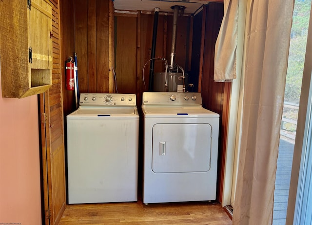 108 Toothman Run Rd, Rivesville, WV 26588 - laundry area with water heater, laundry area, washing machine and dryer, and wood finished floors