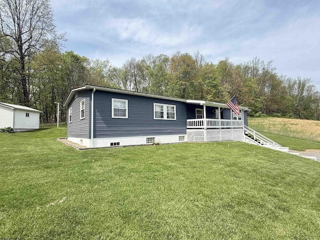 view of front of home featuring a porch and a front yard