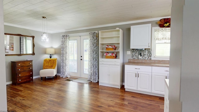 sitting room featuring visible vents, french doors, and wood finished floors