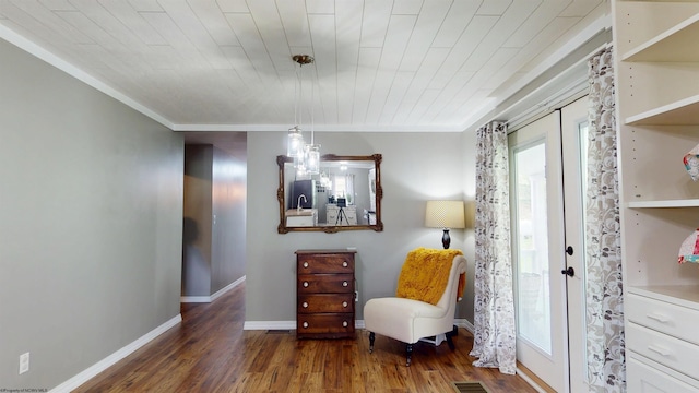 sitting room with baseboards, ornamental molding, wood ceiling, and wood finished floors
