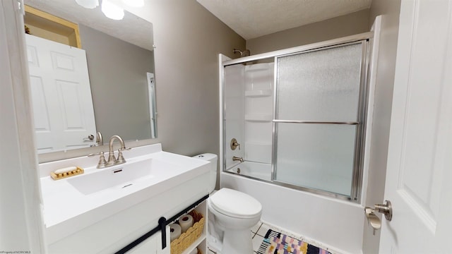 full bathroom with a textured ceiling, tile patterned flooring, vanity, toilet, and enclosed tub / shower combo
