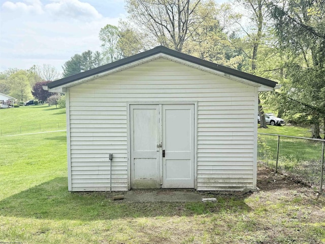view of shed with fence