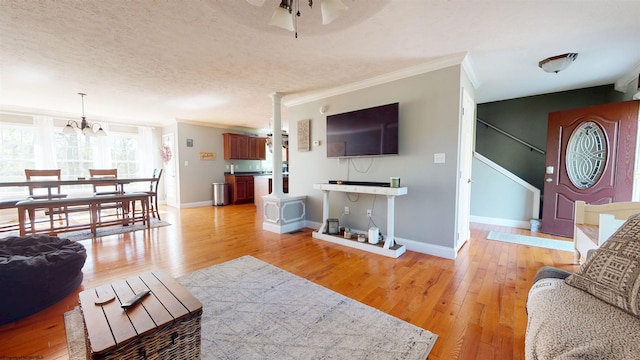 7 Mayberry Dr, Fairmont, WV 26554 - living area with crown molding, baseboards, light wood-style flooring, and stairway