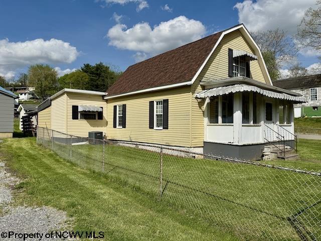 346 Parkway Ave, Anmoore, WV 26323 - back of house featuring central AC, fence, and a yard