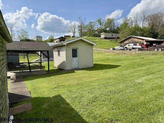 346 Parkway Ave, Anmoore, WV 26323 - view of yard featuring a storage unit and an outbuilding