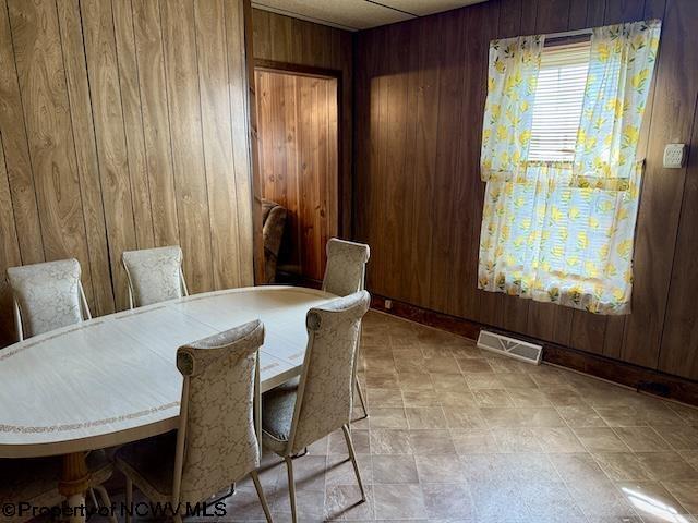 346 Parkway Ave, Anmoore, WV 26323 - dining space featuring wood walls and visible vents
