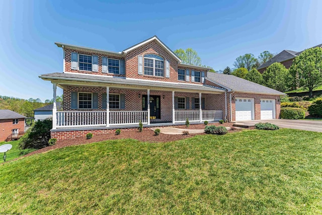 view of front facade with brick siding, driveway, and covered porch