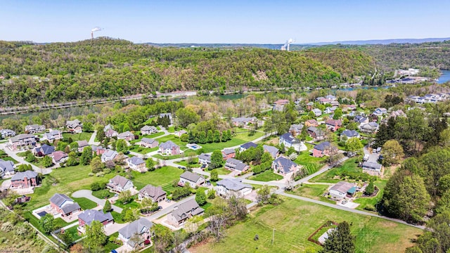 aerial view with a water view and a view of trees