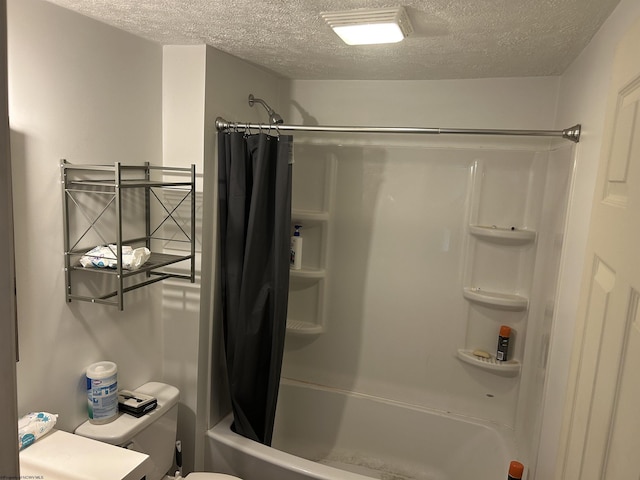 bathroom with toilet, a textured ceiling, and shower / tub combo with curtain