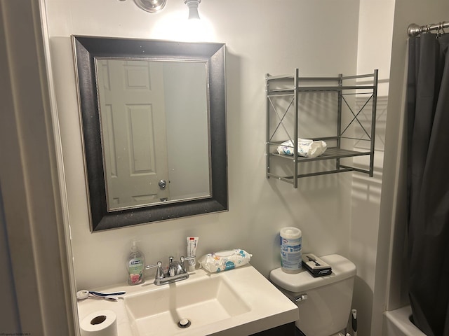 full bathroom with vanity and toilet