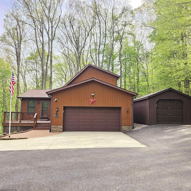 view of front of home with driveway and a garage
