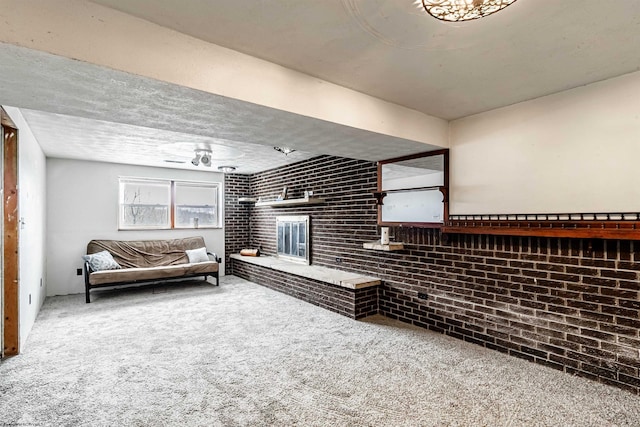 210 Rosedale Hill Rd, Maidsville, WV 26541 - living room with a ceiling fan, carpet, a brick fireplace, and brick wall
