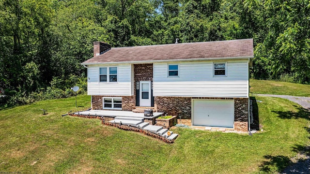 210 Rosedale Hill Rd, Maidsville, WV 26541 - raised ranch with a garage, a front yard, a chimney, brick siding, and a forest view
