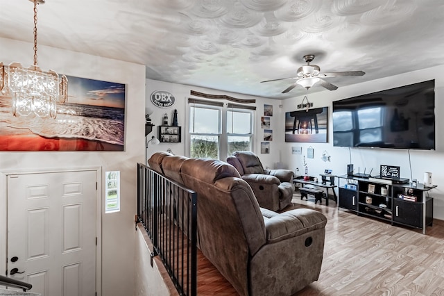 210 Rosedale Hill Rd, Maidsville, WV 26541 - living room with ceiling fan with notable chandelier and wood finished floors