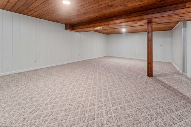 finished below grade area with wood ceiling, carpet flooring, and recessed lighting