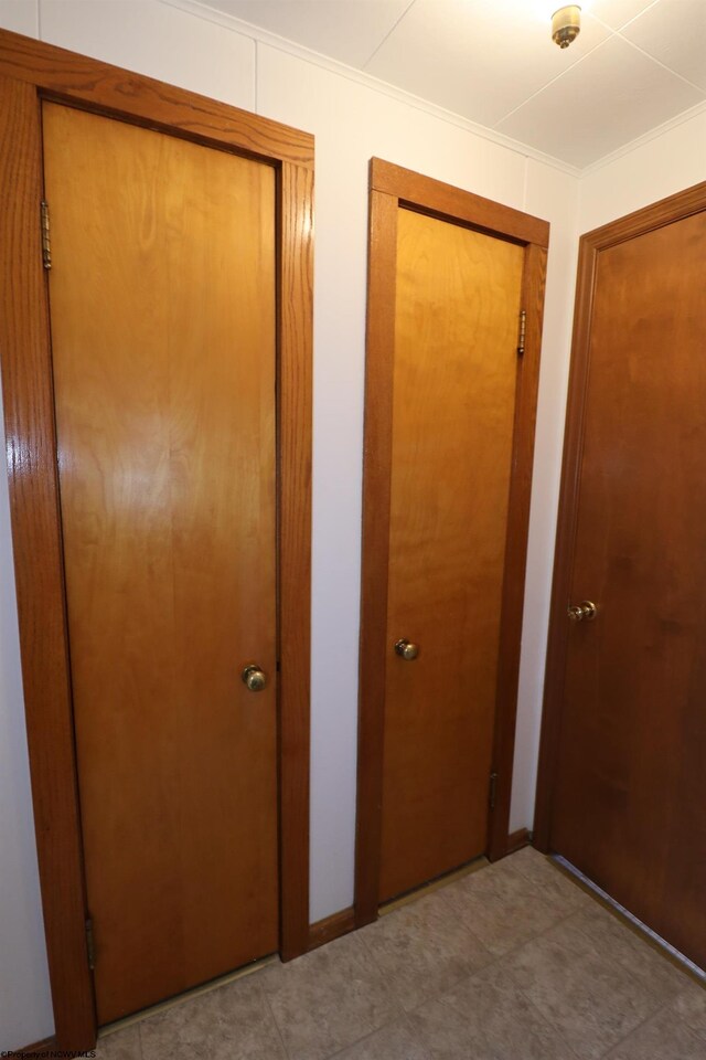 unfurnished bedroom with ornamental molding