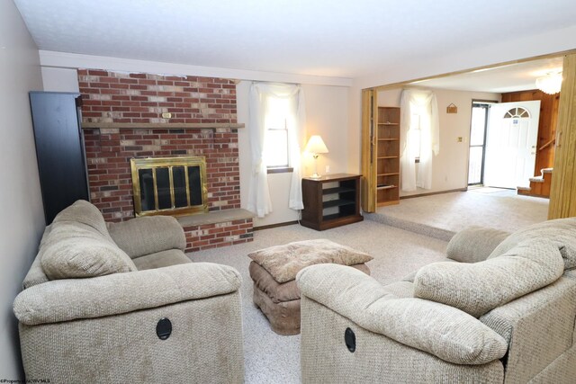carpeted living room featuring a fireplace