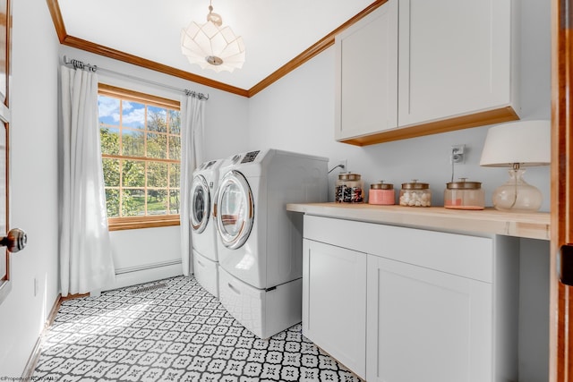 washroom featuring crown molding, cabinet space, and washer and dryer