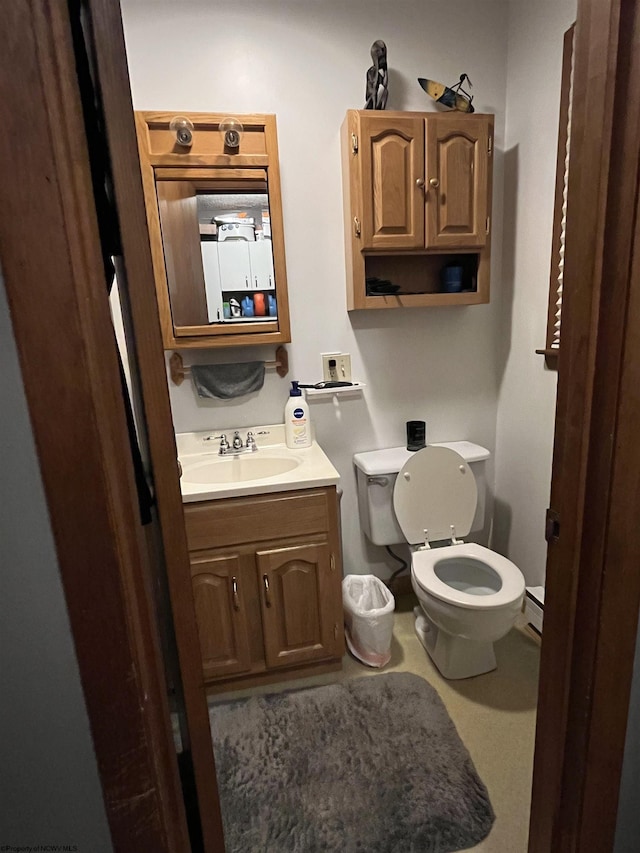 bathroom with toilet and vanity