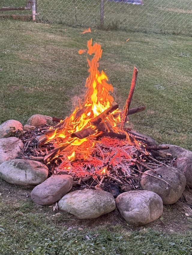 235 Hickory Dr, Elkins, WV 26241 - exterior view of fence and an outdoor fire pit