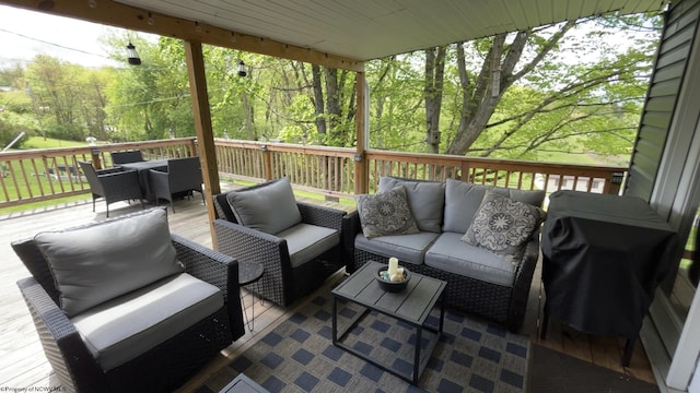 wooden deck featuring outdoor dining space and an outdoor living space