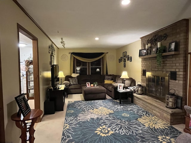 living area with carpet floors, recessed lighting, and a brick fireplace