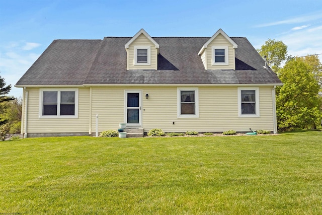 view of front facade with a front lawn and entry steps