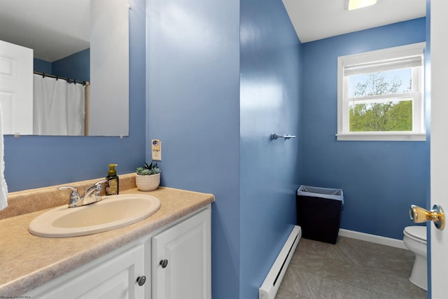 full bathroom featuring toilet, baseboards, a baseboard heating unit, and vanity