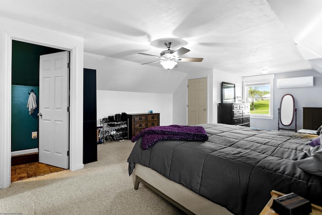 bedroom featuring vaulted ceiling, carpet floors, a ceiling fan, and an AC wall unit