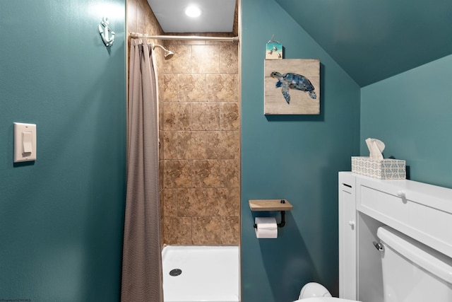full bathroom featuring toilet and a shower stall